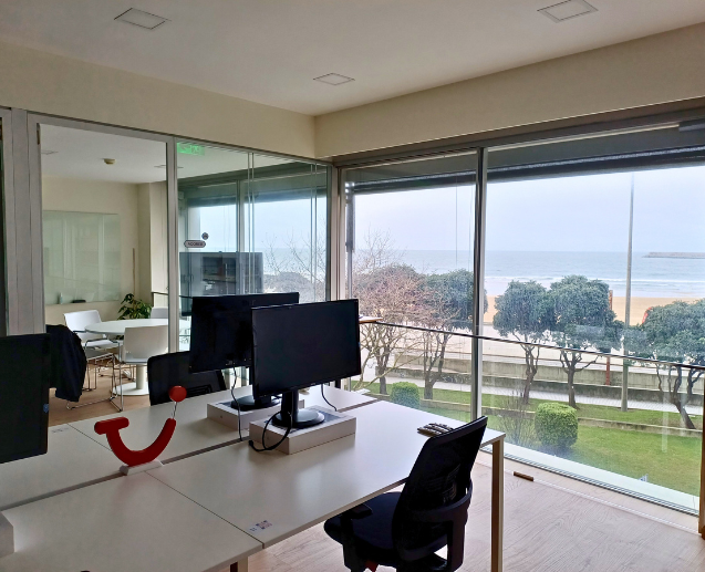A inviting open office with desks and a lounge area
