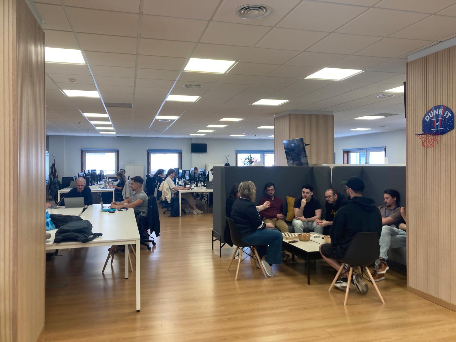 A inviting open office with desks and a lounge area