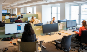 Female Sweden Contact Centre colleagues work at their desks.