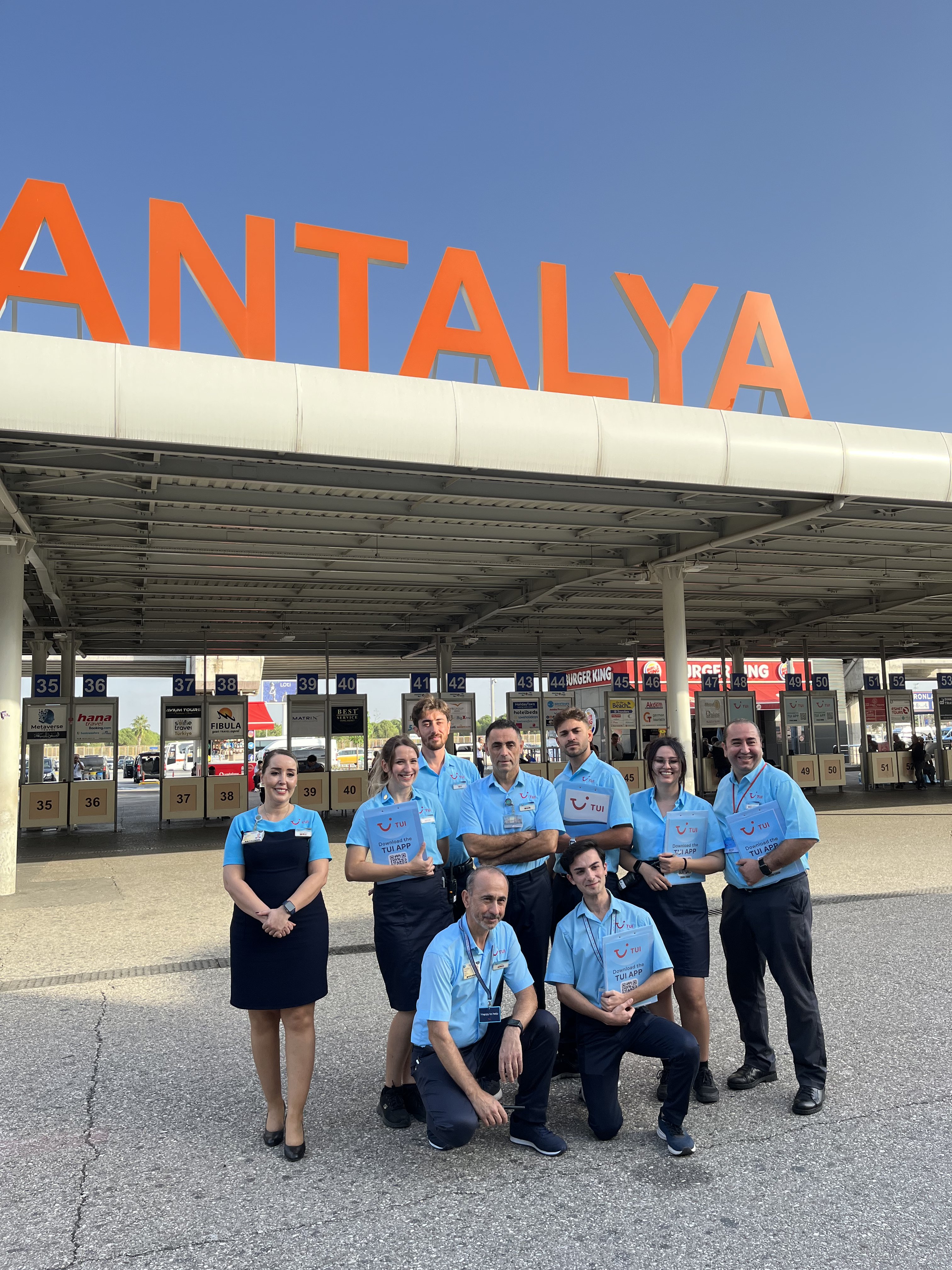 A group of TUI Airport reps in front of Antalya airport