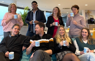 A group of Customer Service Agents enjoying a coffee