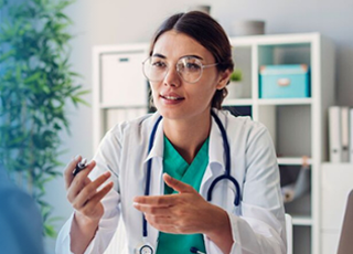 Doctor consulting patient in clinic office