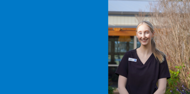 Healthcare worker standing outside care facilityr