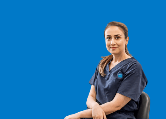 Healthcare professional seated on blue background