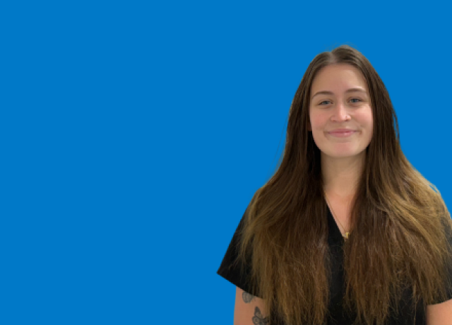 Person with long hair on blue background