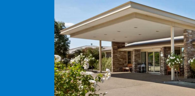 Modern house entrance with covered driveway