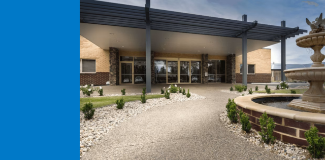 Building entrance with fountain and walkway