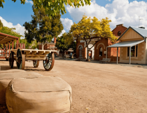 Historic village with wooden cart and brick