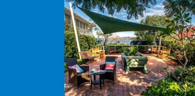 Shaded garden patio with outdoor seating