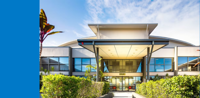 Modern building entrance with blue panel