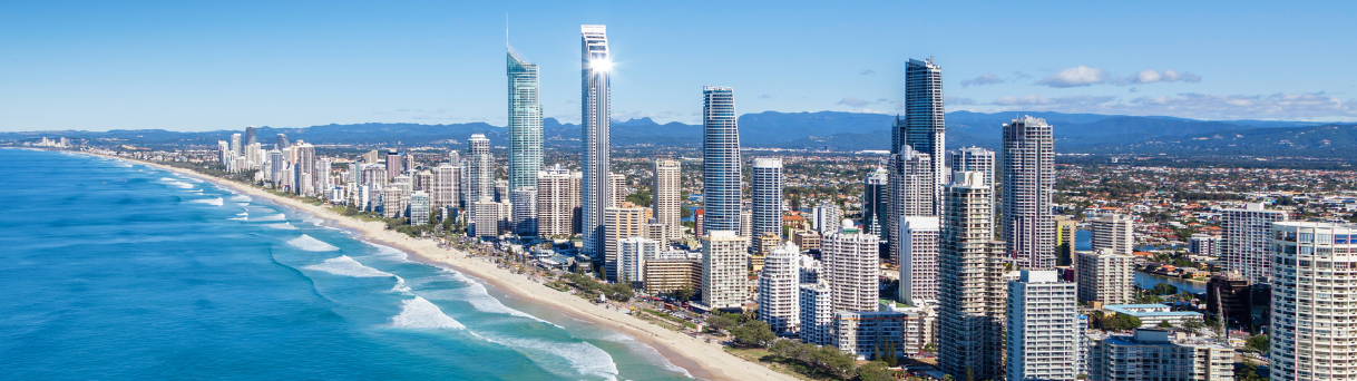 Gold Coast skyline beside ocean with sandy beaches