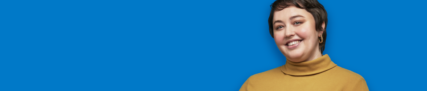 Woman smiling on blue background