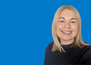 Professional headshot on blue corporate background