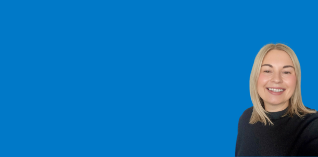 Professional headshot on blue corporate background