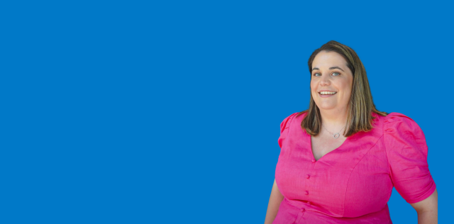 Person in pink blouse on blue background