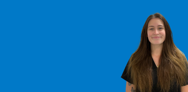 Person with long hair on blue background