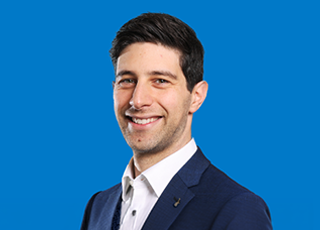 Person in blue suit against blue background