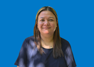 Person standing in blue background, right side