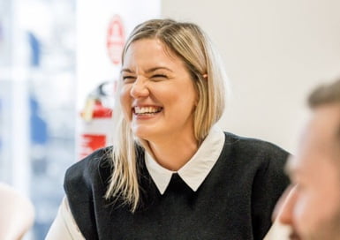 Smiling woman wearing a black top