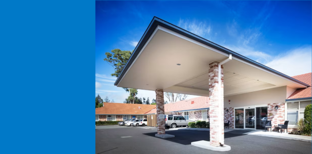 Care home building entrance with covered driveway