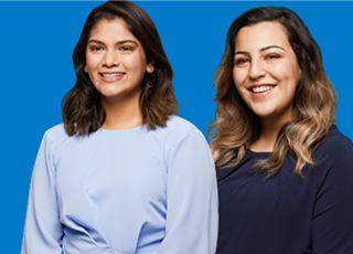 Three people posing against blue background