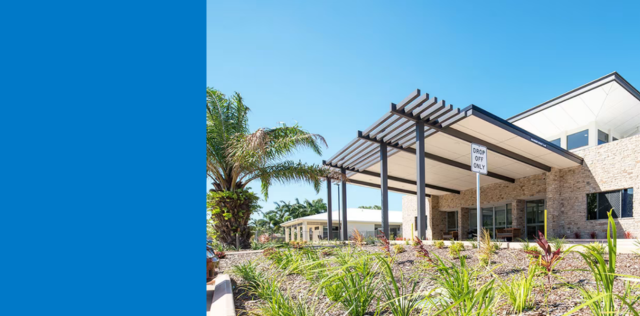 Clinic entrance with tropical landscaping