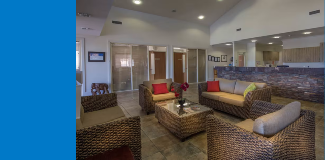 Lobby with wicker sofas and glass doors