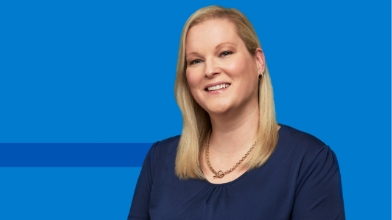 Professional portrait on blue graphic background