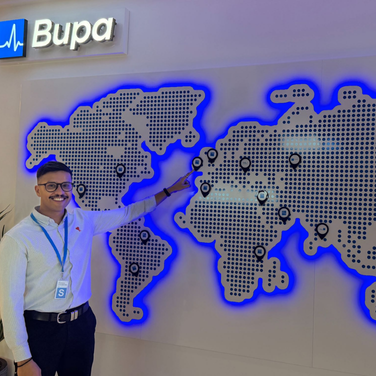 Man pointing at a glowing world map