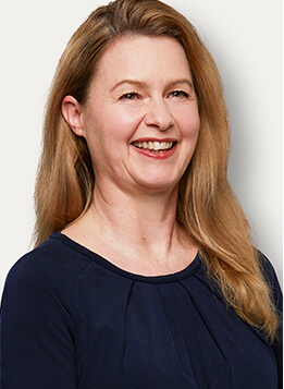 Professional headshot on a neutral background
