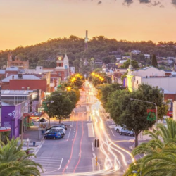 Colorful coastal town street at sunset