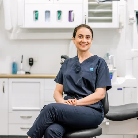 Clinical professional seated in exam room