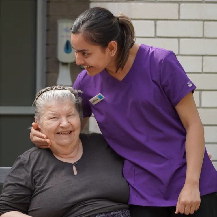 Caregiver supporting elderly resident