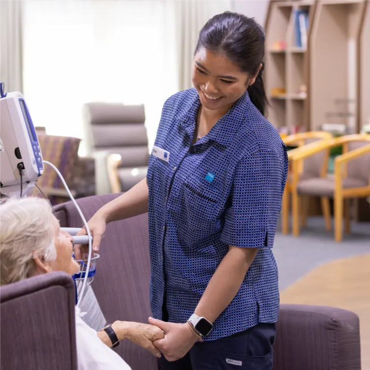 Healthcare worker assisting patient