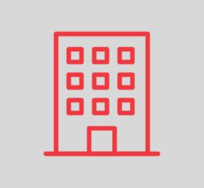 Red line icon depicting a building structure.