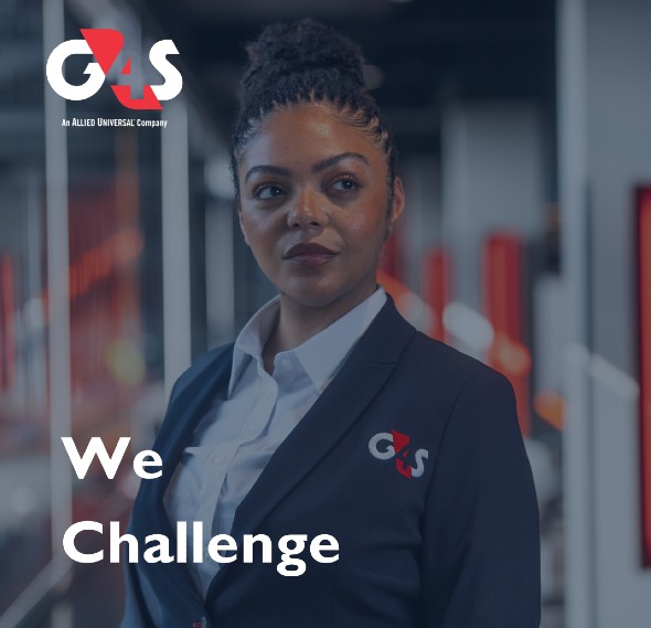 Female G4S security guard smiling in uniform outside