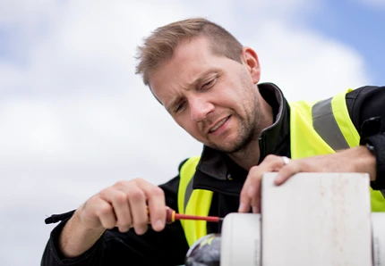 An engineer working with technical equipment.