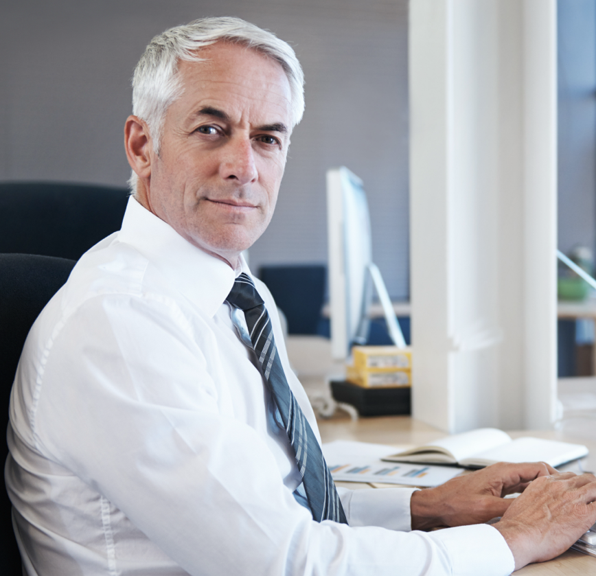Man in white shirt working on a computer