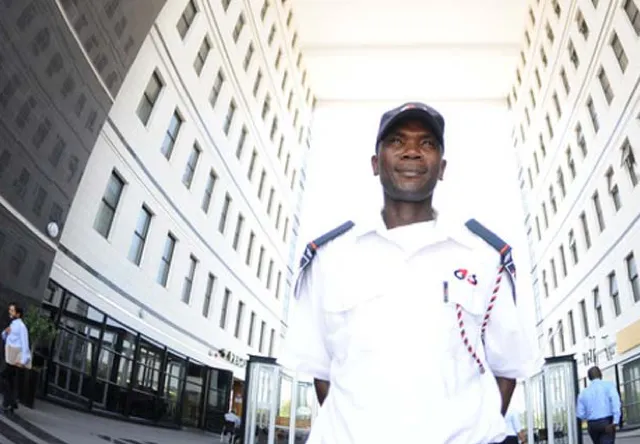 Security guard standing in a street