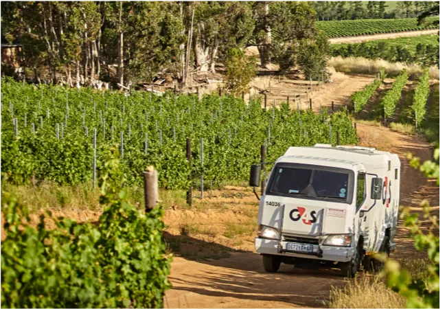 G4S work truck in a field