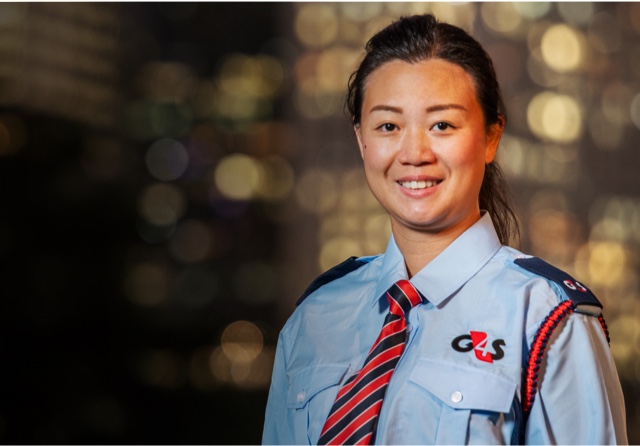 G4S employee smiling in security uniform