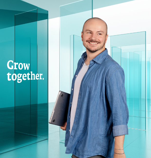 Person with laptop, text says Grow together.
