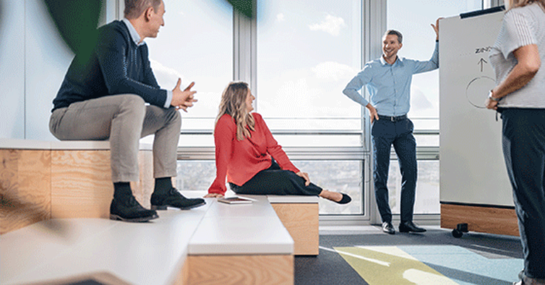 Team chatting in office space