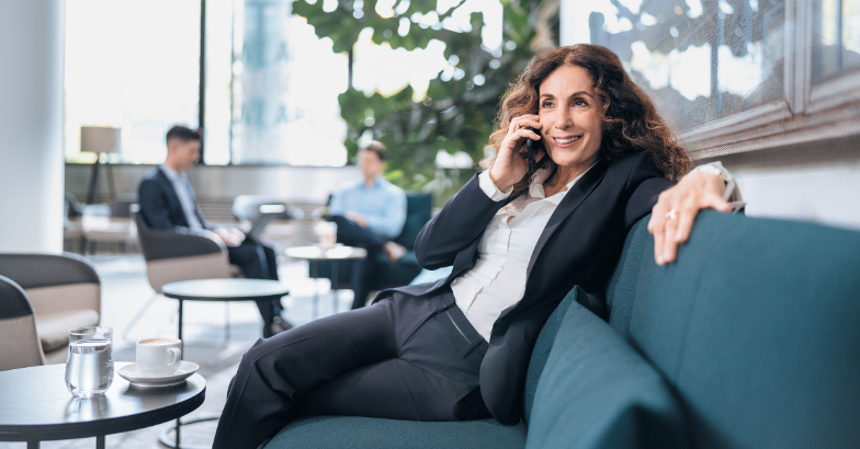 Woman talking on phone in office