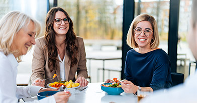 Woman with laptop in office lounge