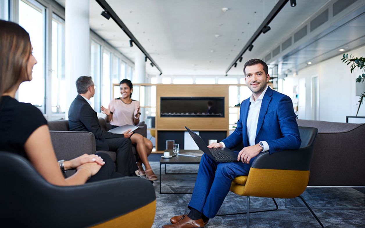 People meeting in modern office lounge