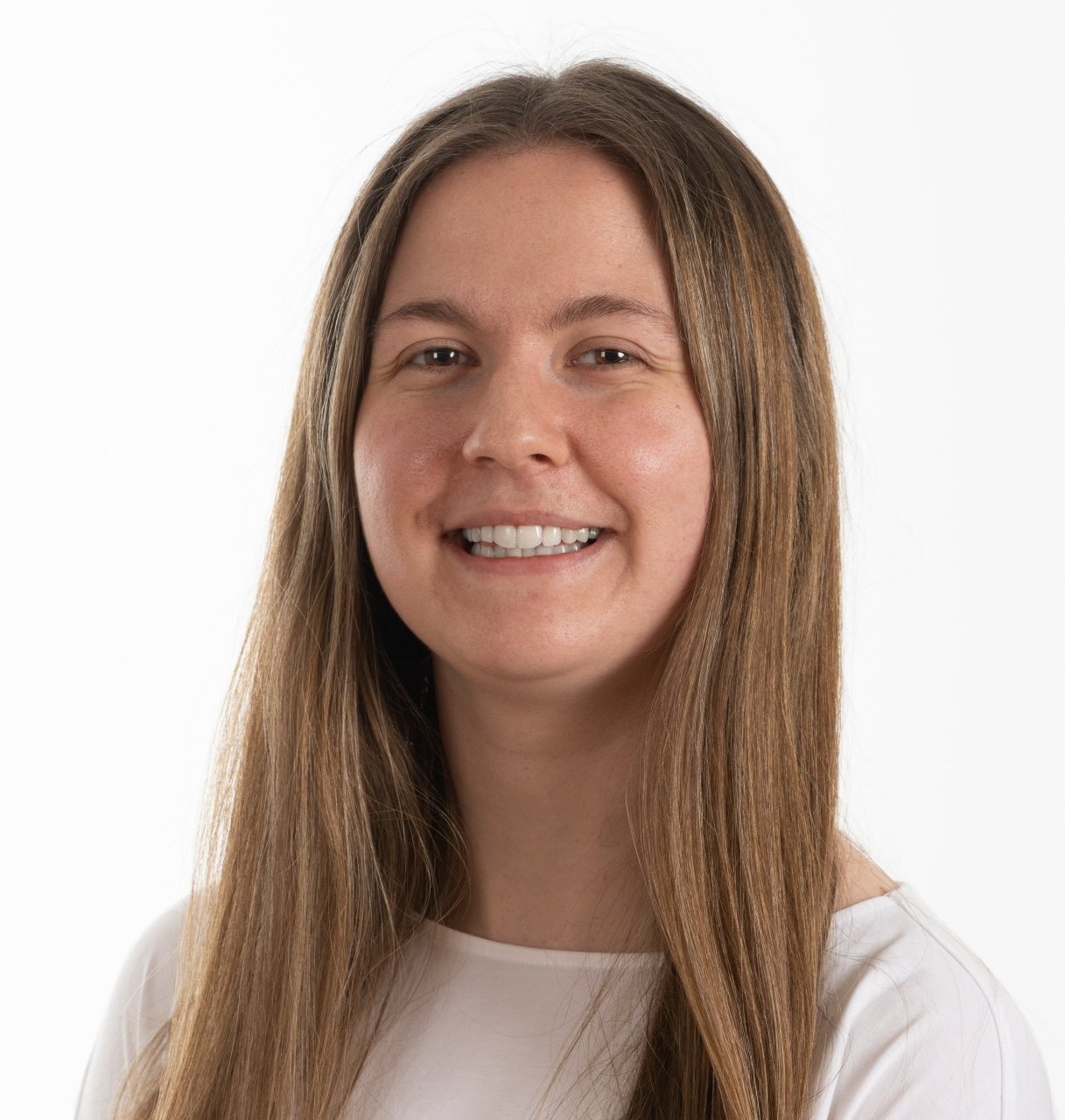 Young woman smiling into the camera.