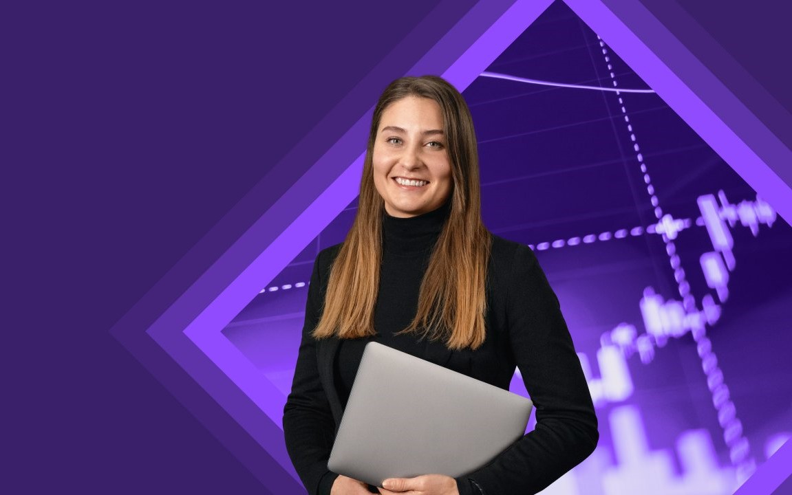 Young woman smiling with laptop under her arm in front of a tech background.