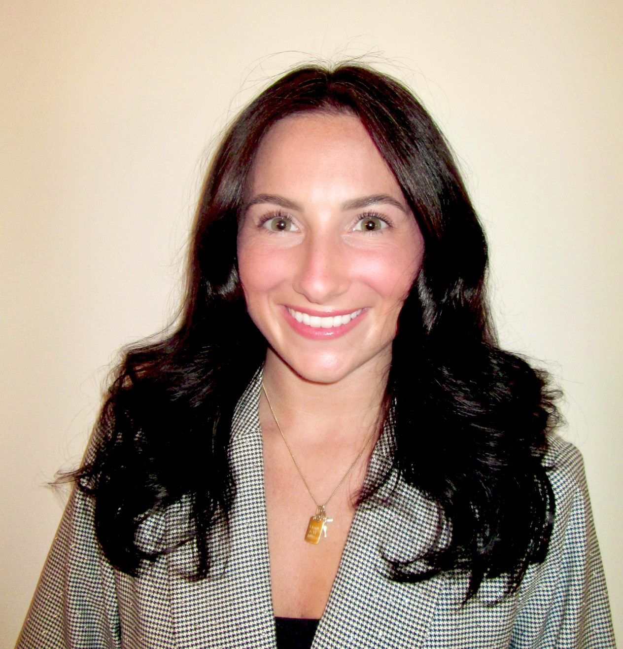 Young woman smiling into the camera.