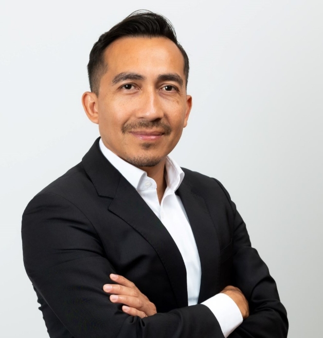 Confident man posing in formal business wear.